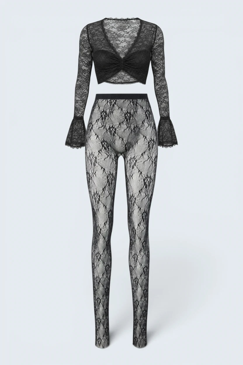 The Saint 54 black floral lace two-piece set with long-sleeved v-neck crop top and high-waisted leggings.