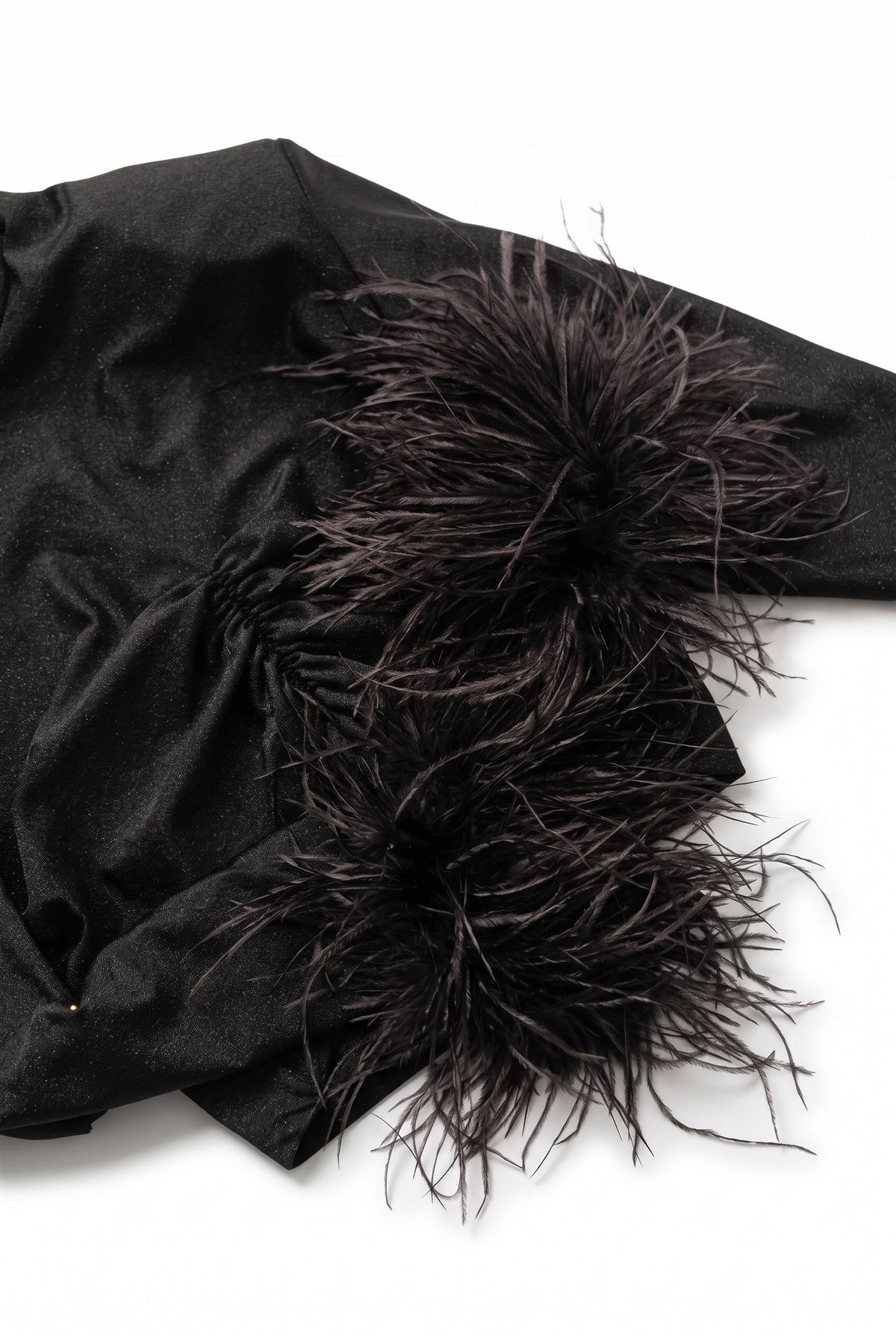 The Saint 54 Miss Rose black long-sleeve crop top featuring elegant ostrich feather cuffs on a detail picture
