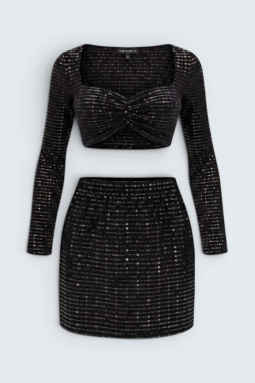 The Saint 54 Set Glamour black long-sleeve cropped top and matching mini skirt in textured sequin stretch fabric.